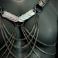 metal body chain harness with silver heart scales and dark metallic chains, edgy and bold fashion statement