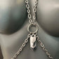 Silver chain body harness with heart and leaf-shaped pendants, sleek metallic style, edgy feel
