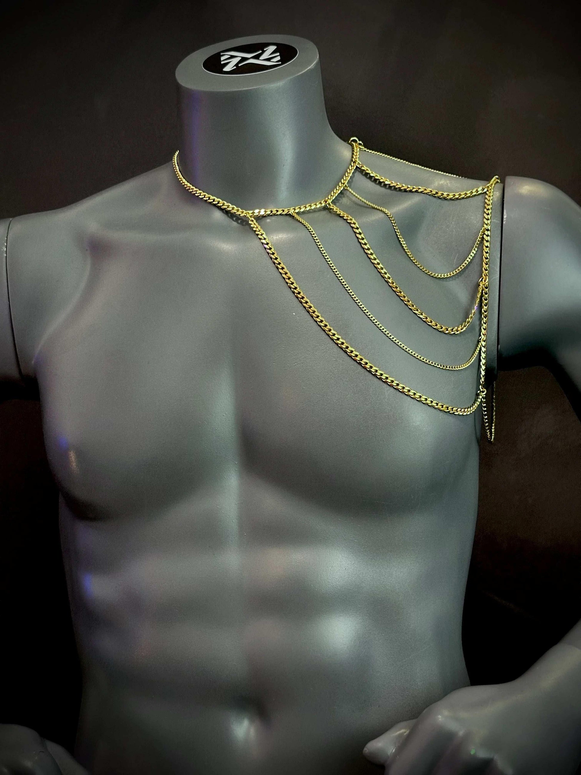 gold chain shoulder jewelry on gray mannequin, stylish and bold, evoking confidence