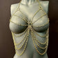 gold chain body jewelry on gray mannequin, stylish and edgy fashion accessory, bold and confident