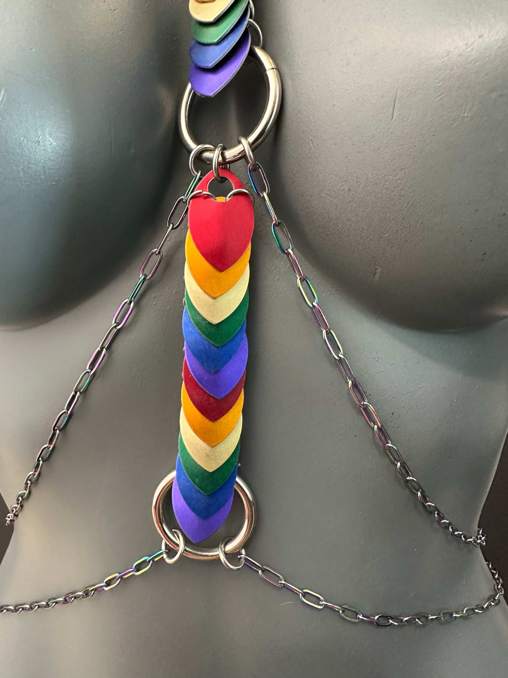 Body chain with multicolor heart-shaped leather pieces and silver metal chains, vibrant and edgy style