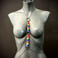 Body chain with rainbow-colored heart charms in silver and brass tones, bold and expressive style