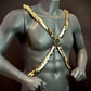 gold chain harness with glossy scale design on gray mannequin torso, bold and stylish