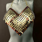 Metallic scale bra top in gold and bronze on a gray mannequin, bold and striking style