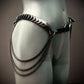 black metal chain belt with scaled details and draped chains on gray mannequin, edgy style, bold vibe