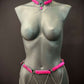 body chain jewelry in pink and silver on gray mannequin, edgy and bold style, confident vibes