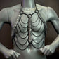 Silver metal chain body harness with black chains and snake scale details, edgy and bold style