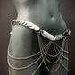 Body chain accessory silver metal scales with cascading chains on gray mannequin, edgy and bold