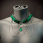 necklace green modern style with silver chains on mannequin evokes edgy sophistication