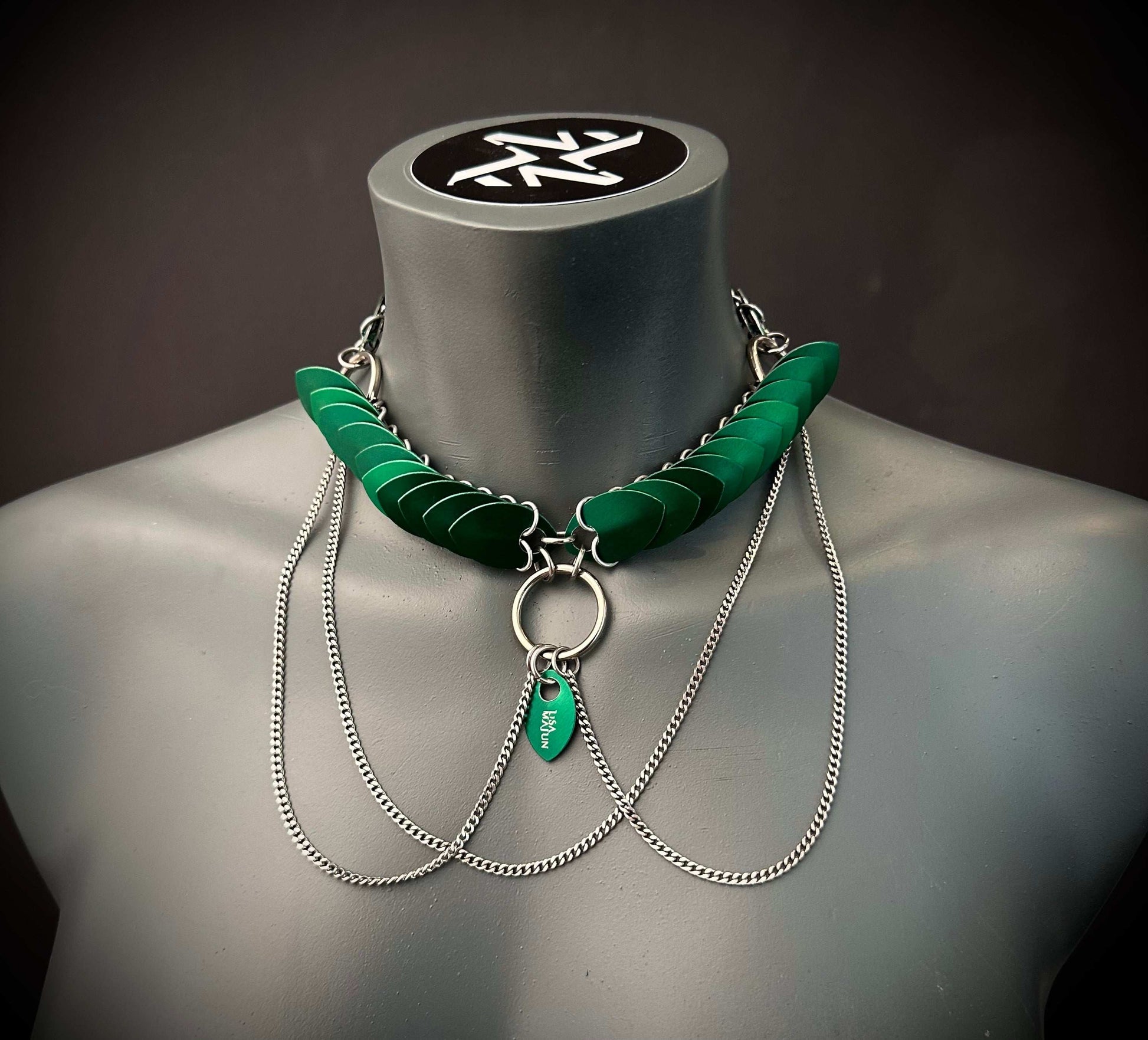 necklace green modern style with silver chains on mannequin evokes edgy sophistication