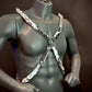 silver metallic harness on gray mannequin torso with confident pose