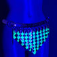 glowing green scale chainmail belt on mannequin hip under blue light, futuristic edgy style