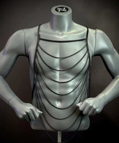 black chain body harness on gray mannequin torso, edgy and modern style