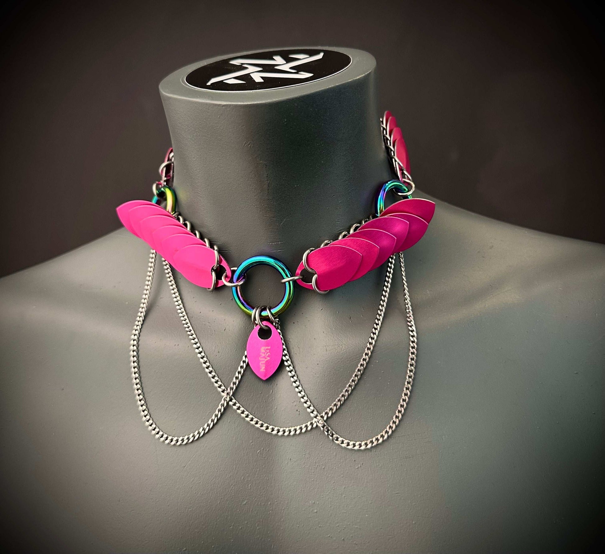 Choker necklace with pink scales and silver chains, rainbow metal rings, edgy and bold style