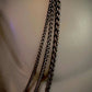Silver chain necklace with multiple braided strands in a stylish, elegant design