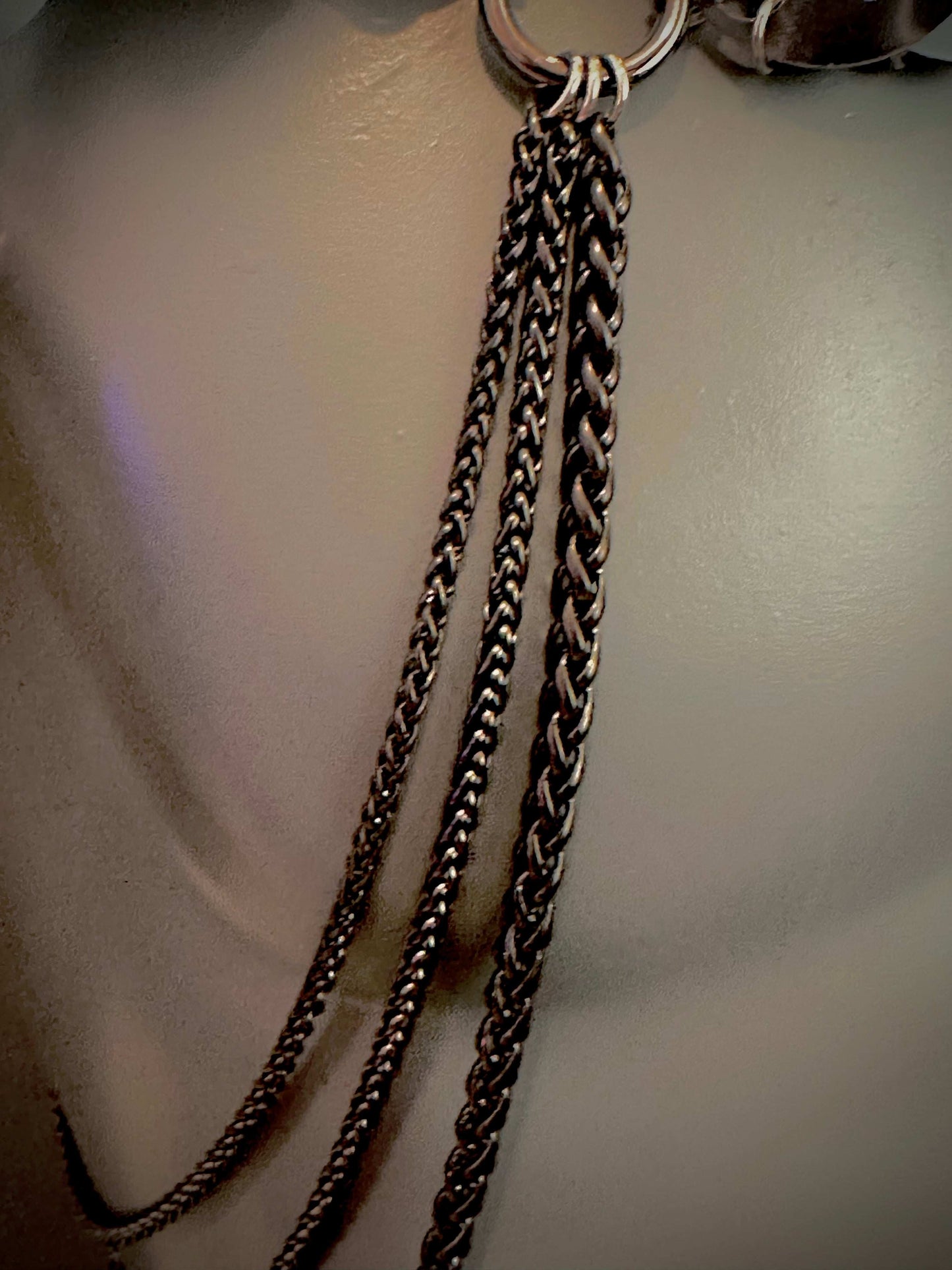 Silver chain necklace with multiple braided strands in a stylish, elegant design
