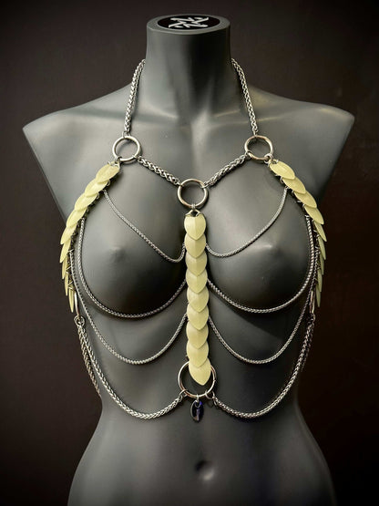 metal body chain harness in silver with translucent leaf accents on black mannequin, edgy and bold fashion