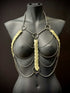 metal body chain harness in silver with translucent leaf accents on black mannequin, edgy and bold fashion