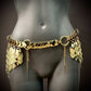 Gold metal chain belt with overlapping scales and dangling spikes, shiny and elegant style