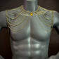 gold chain body jewelry with heart pendant on gray mannequin, elegant and luxurious style, bold and confident