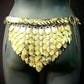 Gold metal scale belt with layered leaf-shaped plates on dark mannequin, bold and edgy fashion