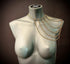 Gold chain shoulder jewelry on gray mannequin, elegant style, luxury and boldness