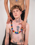 Rainbow heart harness with chains on tattooed shirtless man, modern colorful style, confident vibe